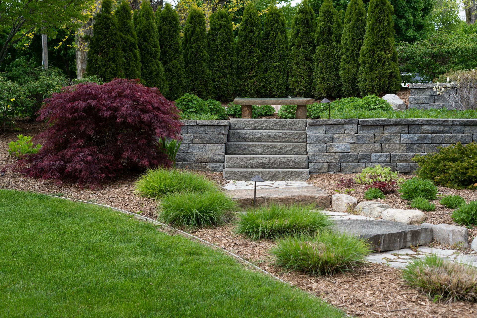Professional Landscaping With Pavers and Boulders